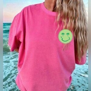 Pink T-Shirt with Green Smiley Face